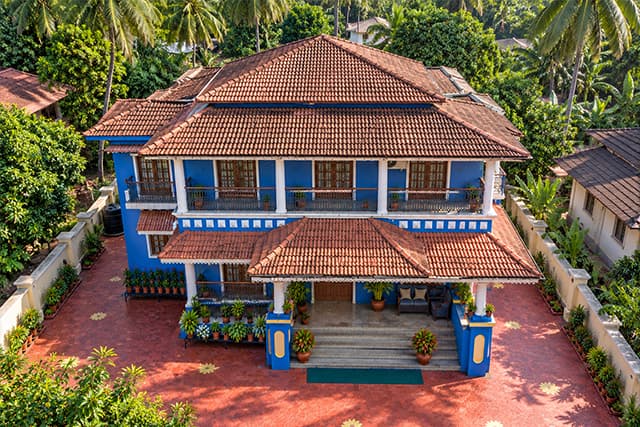 Elevated view of Misquita Exclusive Homestay and its tiled roof.